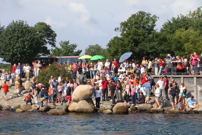 Tourists at the Little Mermaid statue in Copenhagen