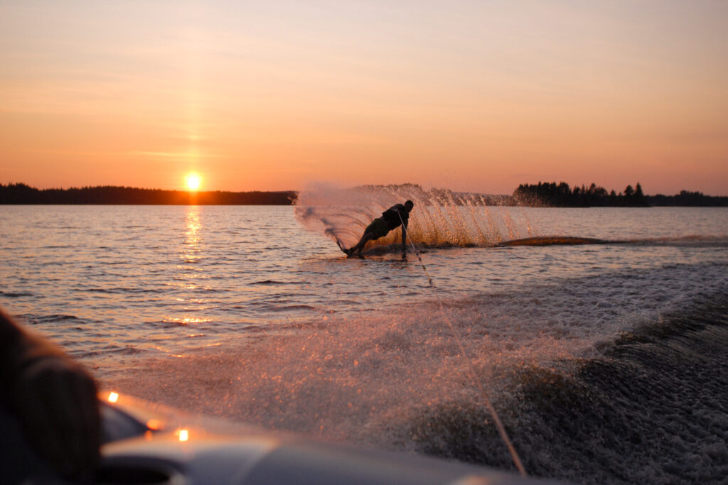 person on water ski during sunset