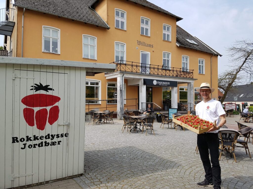 man with fresh strawberries