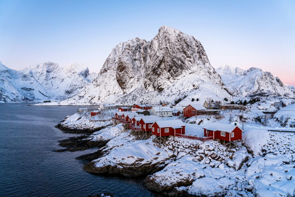 snowy cabins by the sea in the mountains