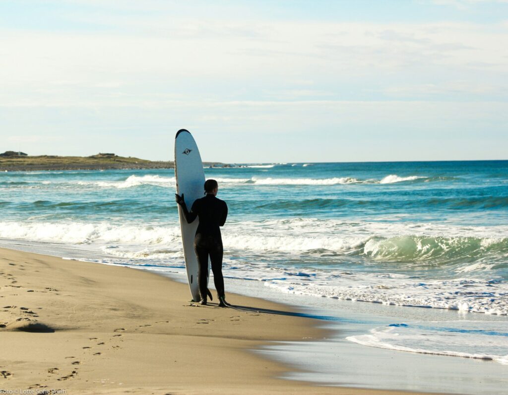 surfer by beach
