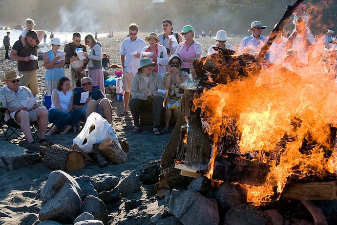 Danes singing Midsommervis by the fire at the Sankthansaften celebrations, Denmark