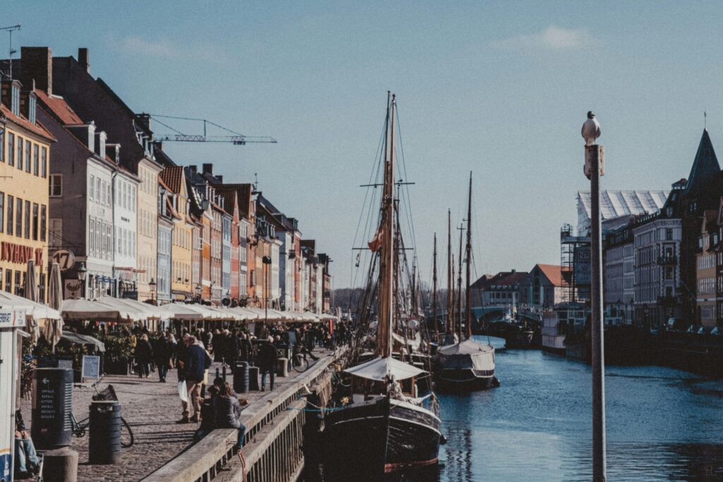 coloured houses by water and boat
