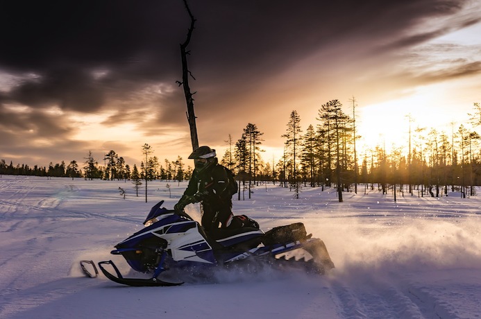 See the northern lights by snowmobile tour in Finnish Lapland