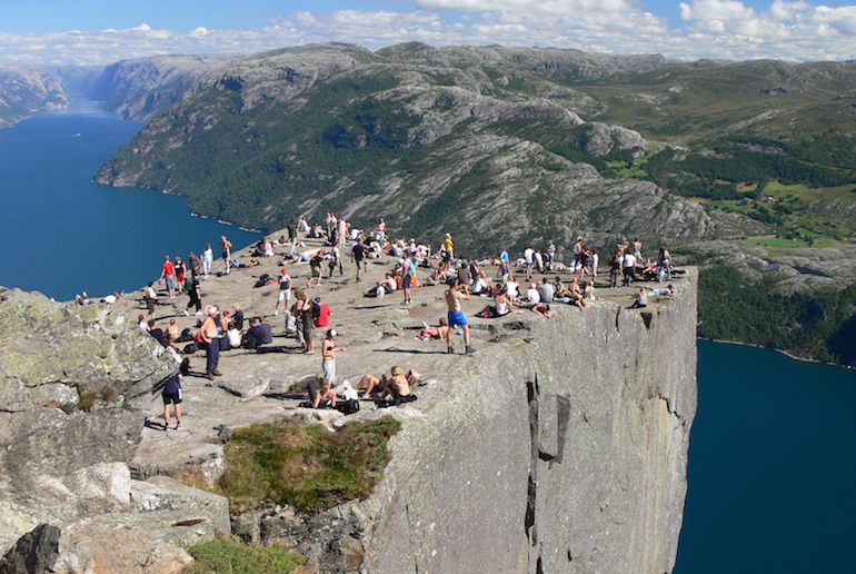 You can take an organised tour to the top of Preikestolen in Norway