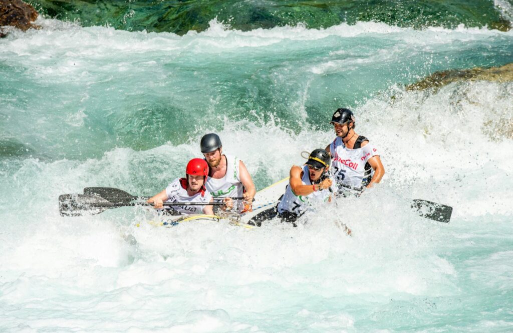 people in a raft in wild water