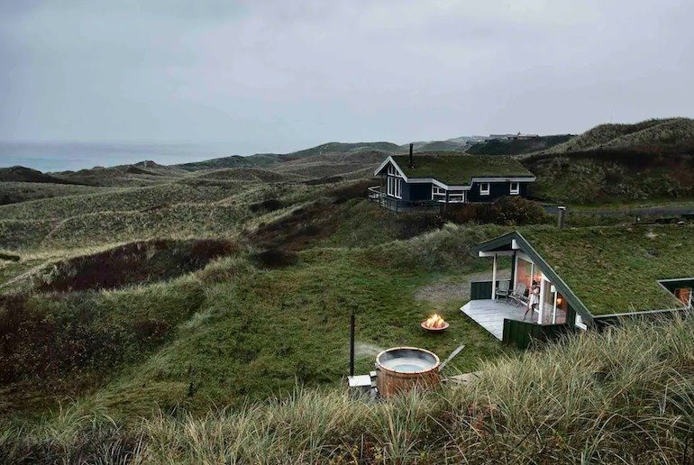 Cabin on the beach in Denmark with sea views and an outdoor hot tube in the dunes