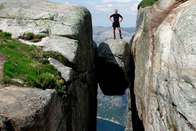 Take an autumn hike up to the Kjerag boulder in Norway