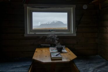 dark cabin with view and a book