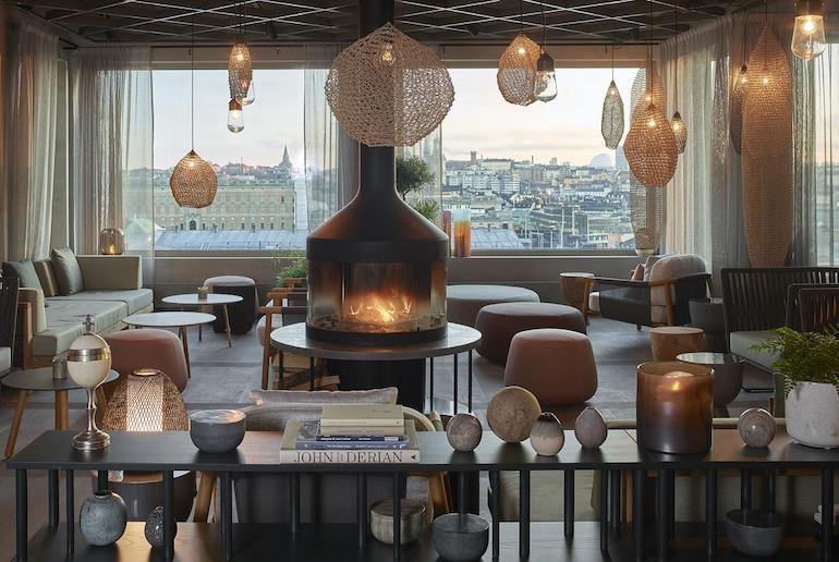 Cosy up round the fireplace in winter at the Hotel Camper Downtown in Stockholm