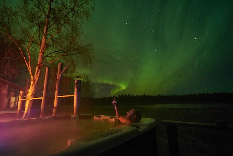 Have a festive hot tub while watching the northern lights at Christmas in Sweden