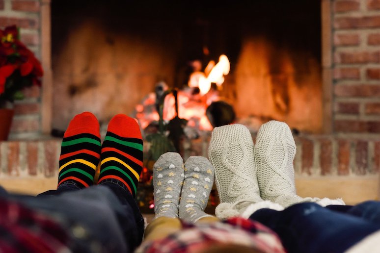 Cosying up by the fire with family or friends is a great way to experience hygge in Denmark.