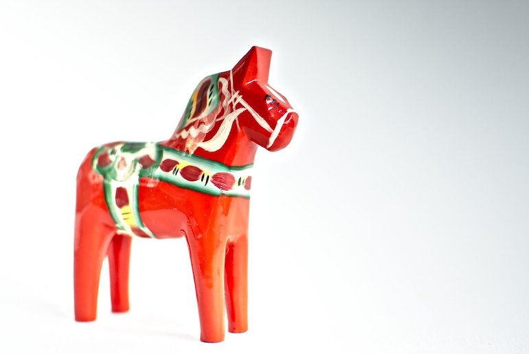 The traditional Dalecarlian horse adds colour to a modest interior in Sweden.