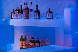 bottles of spirit on a bar made of ice