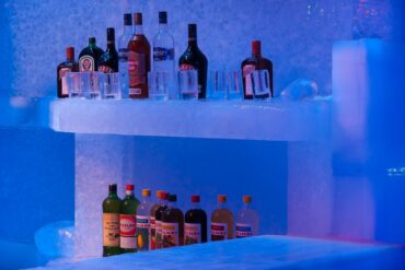bottles of spirit on a bar made of ice
