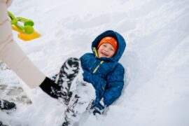 boy playing in snow