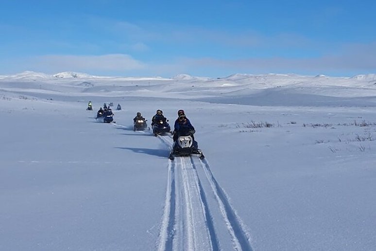 Snowmobile across the frozen Myvatn lake in Iceland