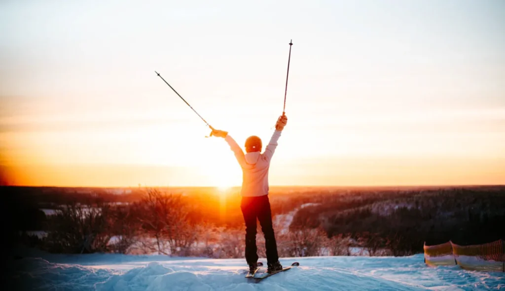 girl on skis at sunset