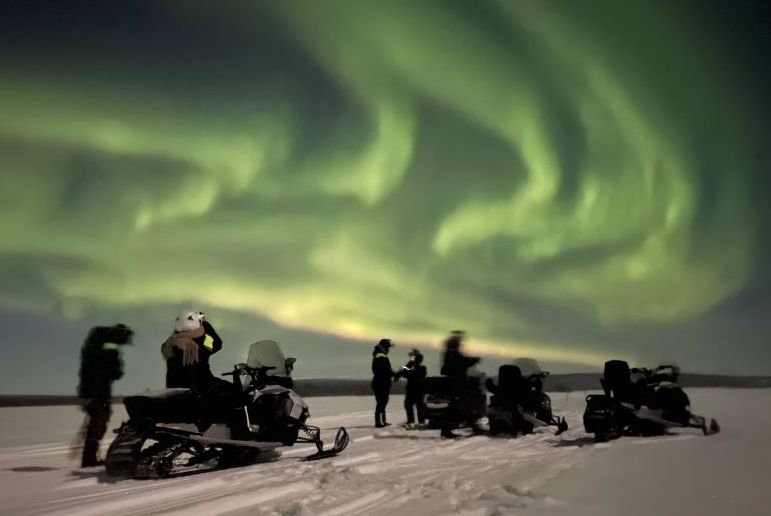 See the northern lights by snowmobile in Kiruna, Sweden