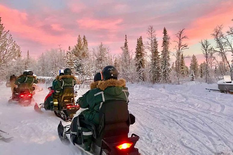Whizz over frozen rivers and lakes by snowmobile from Kiruna, Sweden.