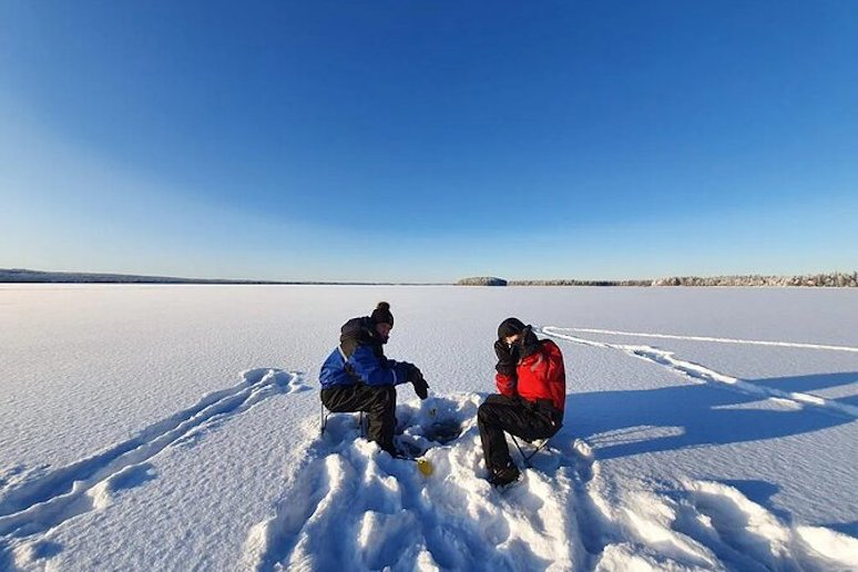 Go ice-fishing by snowmobile from Rovaniemi in Finland