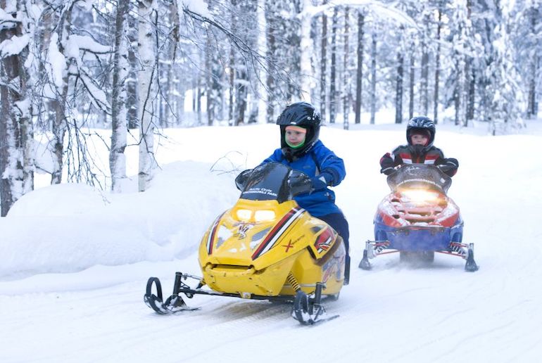 Even kids can go snowmobiling in Rovaniemi, Finland