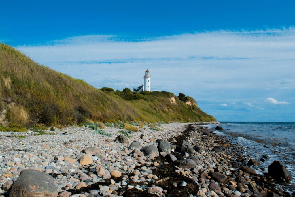 white lighthouse by the coast
