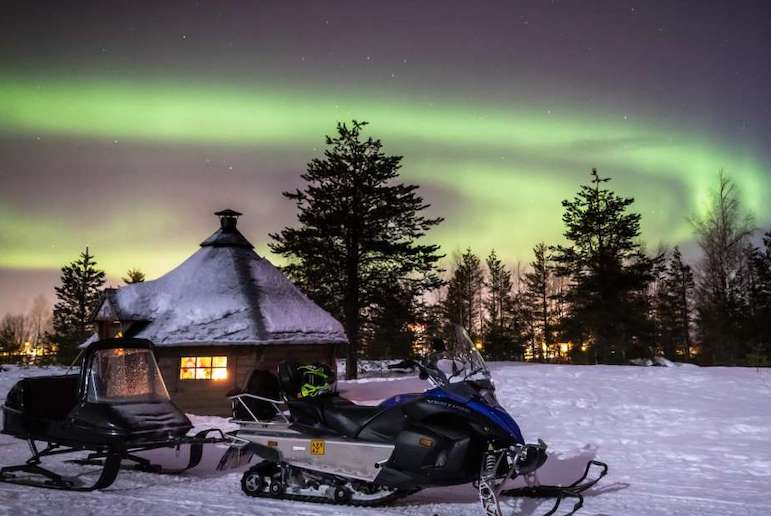 See the northern lights by snowmobile in Rovaniemi, Finland
