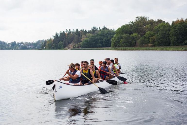 Go on a team-building large canoe trip in the Stockholm archipelago