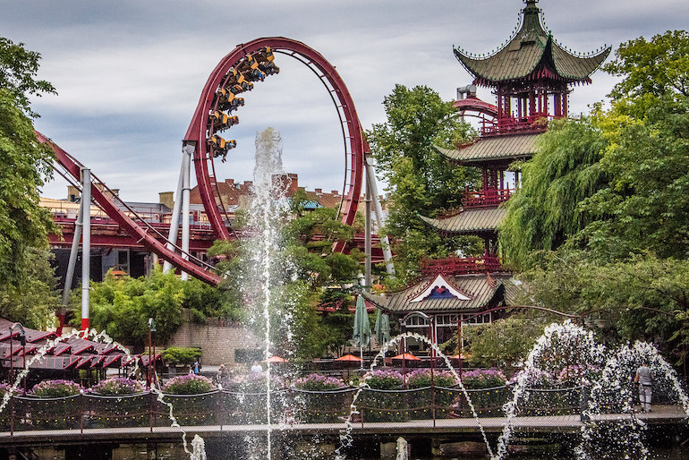 Take a rollercoaster ride at Tivoli Gardens in Copenhagen