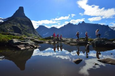 women and girls walking in alps