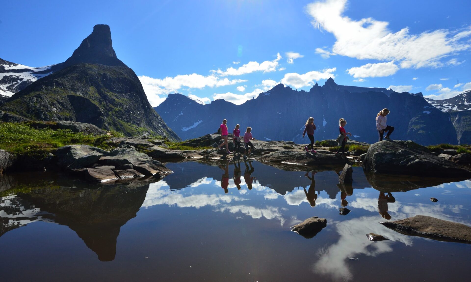 women and girls walking in alps