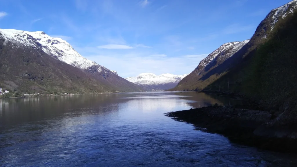 fjord with snow covered mountains
