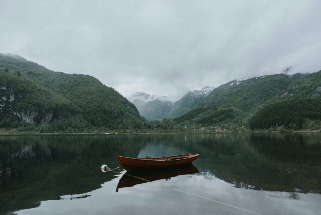 a boat docked in the water in a fjord