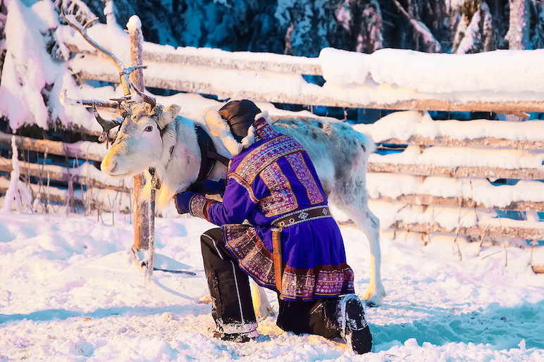 Sami reindeer herders traditionally wore bright, detailed costumes