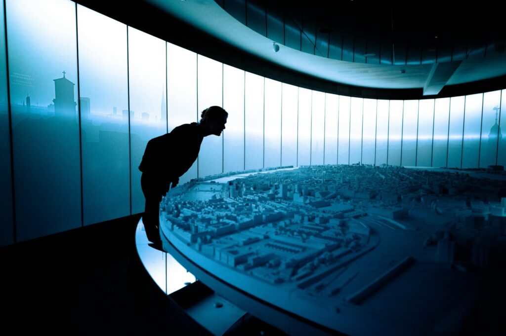 Visitor studies the large city model at the newly re-opened Museum of Copenhagen