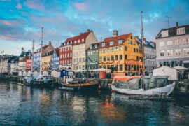 canal with boats and coloured houses, famous copenhagen view