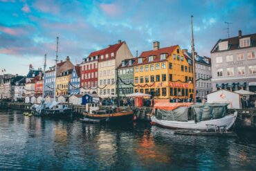canal with boats and coloured houses, famous copenhagen view