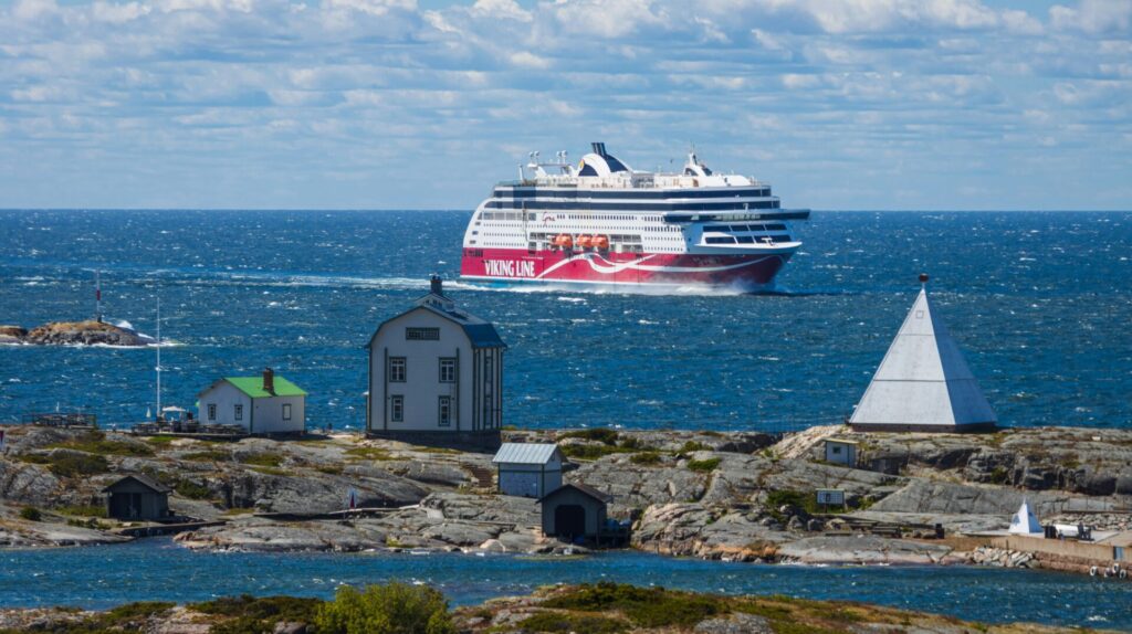 large ship seen from rocky coast