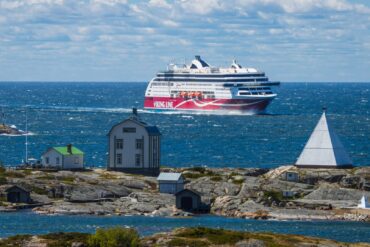 large ship seen from rocky coast