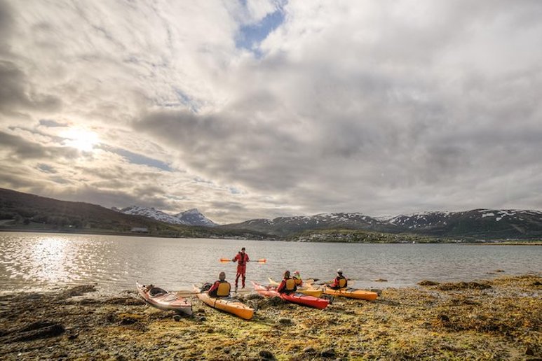 You can go kayaking beneath the midnght sun in summer from Tromso.