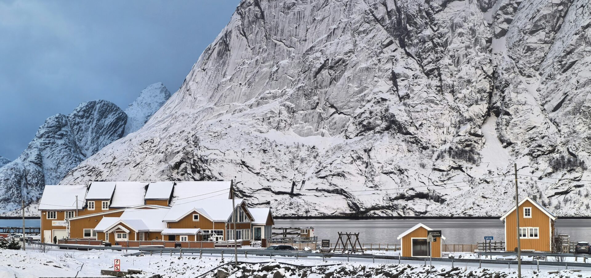 snow covered yellow cabins in the mountains