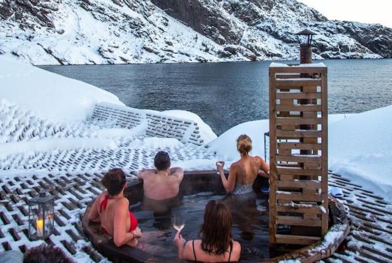 Take an outdoor hot tub at Nusfjord in the Lofoten islands.