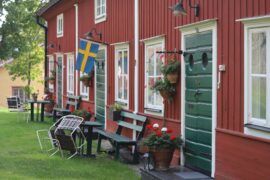red cabin with swedish flag