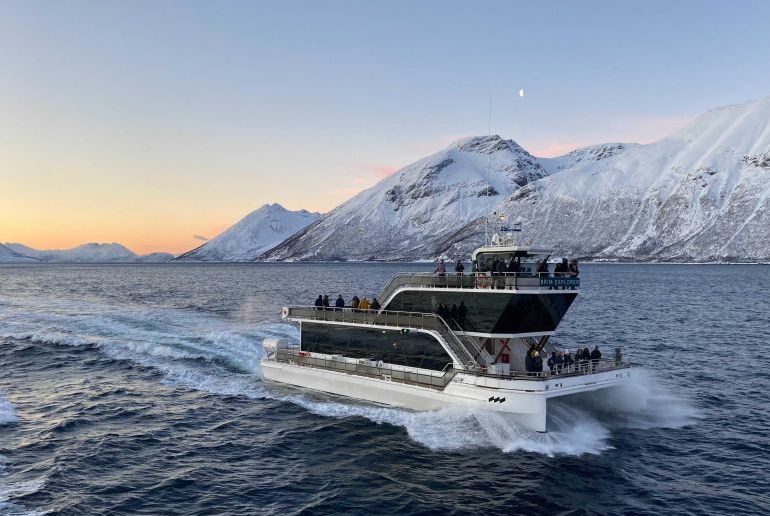 An electric cataraman is a greener way to take a boat trip from Tromso