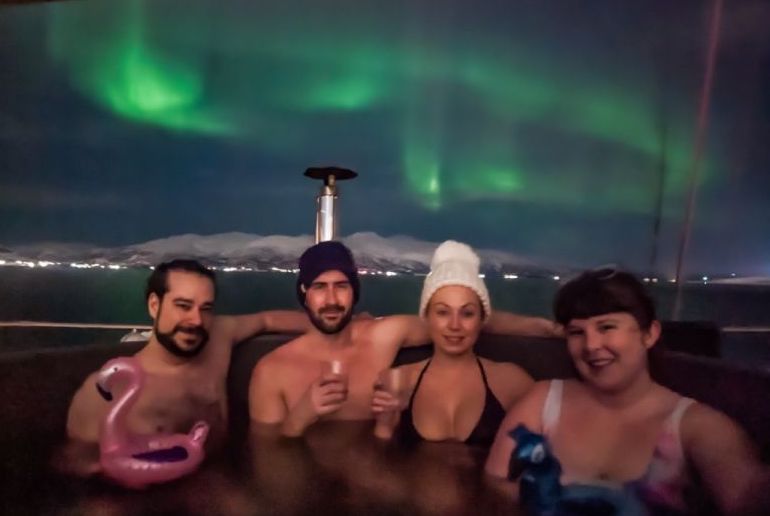 See the northern lights in a hot tub on a. boat trip from Tromso