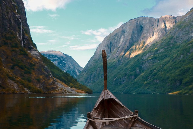 wooden boat on lake in mountains