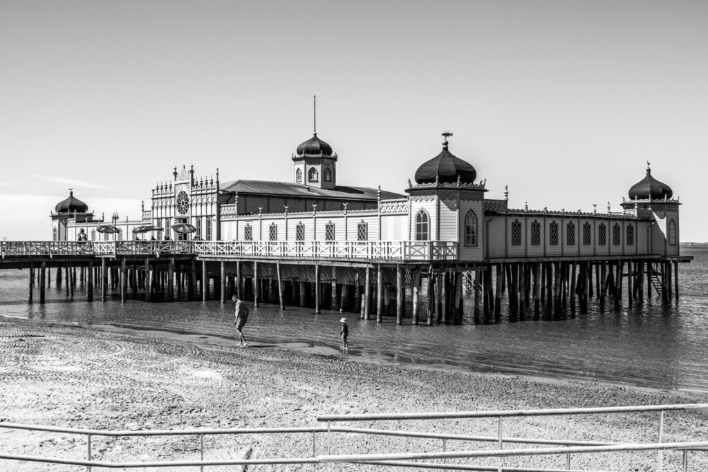 black and white old sauna house on the sea