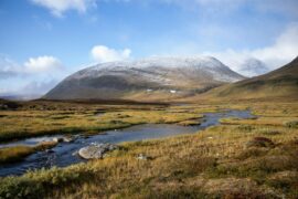 snow capped mountains and river