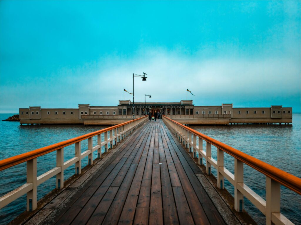 wooden building in the water with pathway